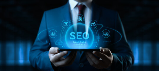 Businessman holding smartphone with Search Engine Optimization SEO icons on screen - Digital Marketing Concept