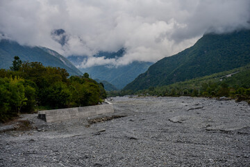Dry river valley and misty mountains near Shaki, Azerbaijan