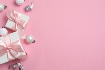 A festive pink backdrop with white ornamenta and gift boxes, Christmas and New Year's concept. Perfect for seasonal promotions, celebrations, and party decor ideas