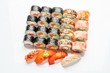 A stunning sushi platter features diverse rolls and fresh toppings, ideal for sharing