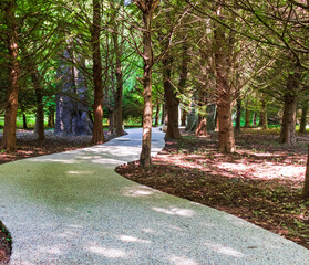 A path paved with small colored pebbles. Texture