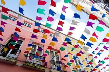 View of the beautiful decoration with colorful plastic pennants for the Sao Joao festival in...