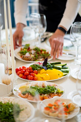 A table adorned with vibrant salads and dishes, highlighting freshness and culinary art