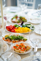 Delicious plates filled with vibrant fruits, vegetables, and seafood enhance a joyful celebration