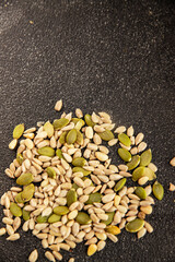 Seed mix sunflower seeds and pumpkin seeds natural product tasty snack fresh delicious gourmet food background on the table rustic top view copy space keto and paleo diet vegan and vegan food