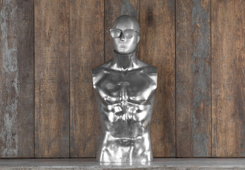 abstract silver mannequin on wooden background
