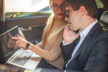 Corporate meeting of two employees in car for work and discussion of business