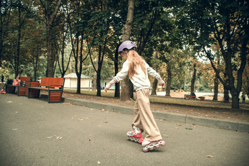 Young Girl Rollerblading in Park Setting for Beginners