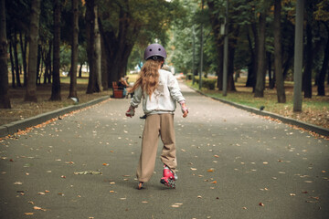 Girl Skateboarding in Park with Helmet and Gloves