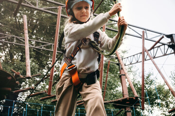 Child Navigating Rope Course Adventure Safely