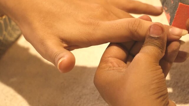 Nail Filler Application During Manicure Treatment