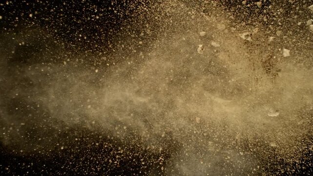 Super Slow Motion Shot of Flying Soil , Isolated on Black Background , Filmed on High Speed Cinematic Camera at 1000 FPS