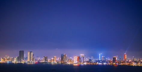 Naklejka premium Da nang city skyline at night with illuminated buildings and urban landscape