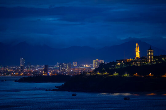 Da nang skyline at night with illuminated lady buddha and cityscape - Powered by Adobe