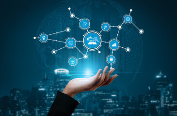 A hand reaching out displays interconnected digital icons against a nighttime city backdrop, symbolizing technology, data analysis, and future business growth. Tessel