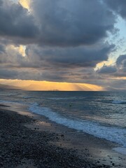 Campofelice di Roccella, a charming Sicilian seaside village in northern Sicily, Italy, featuring gentle Tyrrhenian Sea waves, golden sand, pebbles, and a peaceful Mediterranean coastal landscape