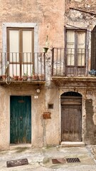 Collesano, a historic Sicilian mountain town in the Madonie Mountains, featuring narrow stone streets, traditional houses, and the Church of San Pietro, Sicily, Italy. Italian town in hills