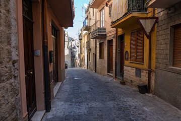 Castelbuono medieval town in the Madonie Mountains, Sicily, Italy, basking under the summer sun with historic streets, Ventimiglia Castle. Old mountain town in Sicily. Italian town in hills