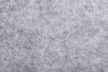 Obraz premium Gray textured paper background with subtle fine grain pattern