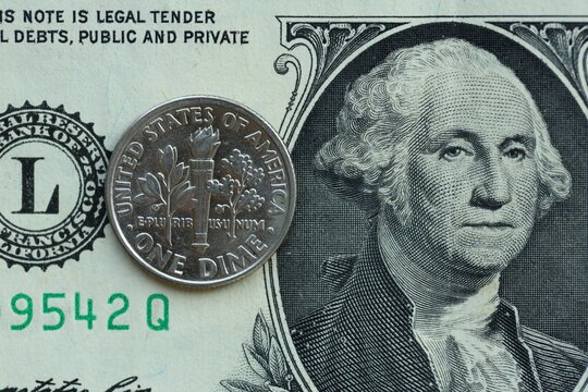 American cent coin on dollar bill close up. United States currency