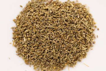 Bunch of anise seeds over a white surface