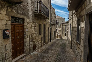 Fotobehang Smalle Straten Petralia Soprana, a historic Sicilian mountain town in the Madonie Mountains, featuring charming narrow streets, traditional stone houses, and famous Church of Saint Mary of Loreto, Sicily, Italy  © Chawran