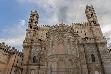 Fototapeta premium Palermo, the historic Sicilian capital city, featuring the monumental city gate, Palermo Cathedral, ornate baroque architecture, and charming narrow streets filled with history, Sicily, Italy