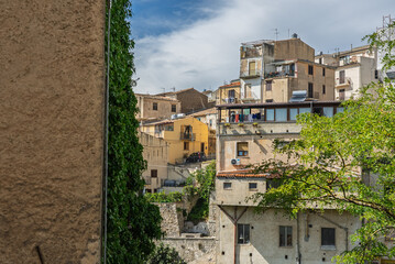 Polizzi Generosa, a picturesque Sicilian mountain town perched on rocky cliffs showcasing traditional stone buildings and panoramic views of the Madonie Mountains, Sicily, Italy