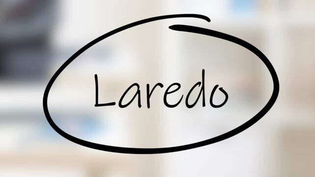 Laredo Handwriting using black marker on glass