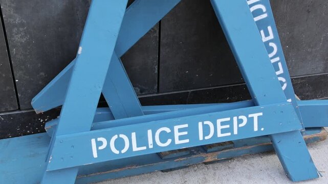 police department line do not cross nypd barricade blue road block wooden barrier piled on sidewalk in brooklyn new york (crime protest closure) dept storage criminal 