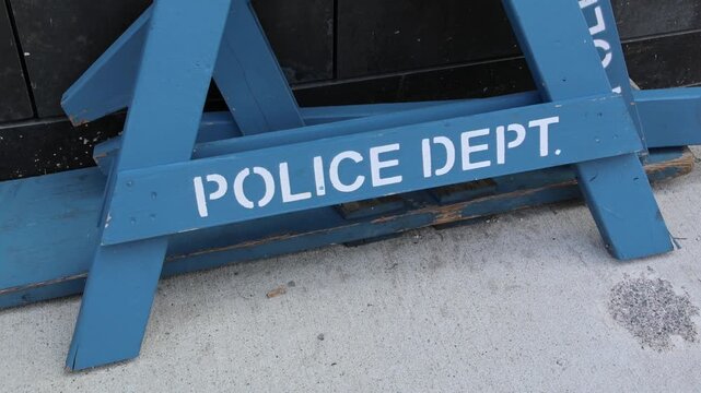 police department line do not cross nypd barricade blue road block wooden barrier piled on sidewalk in brooklyn new york (crime protest closure) dept storage criminal