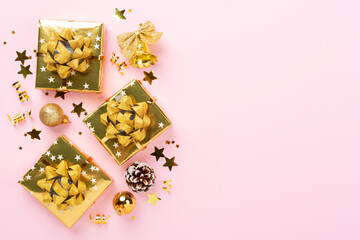 Golden gift boxes and decor on color background, top view