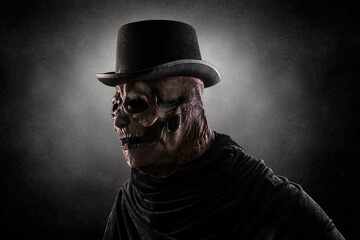 Creepy figure with black vintage top hat in the dark