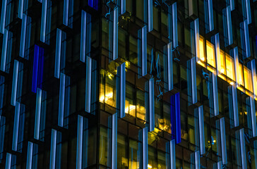 Windows in the modern office building at night. Business concept	