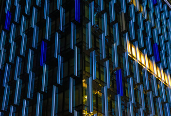 Windows in the modern office building at night. Business concept	