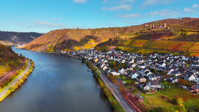 Aerial drone view of wine region of the Mosel Valley in autumn. Wine tourism Turant Castle, Rhineland-Palatinate, Germany . High quality 4k footage
