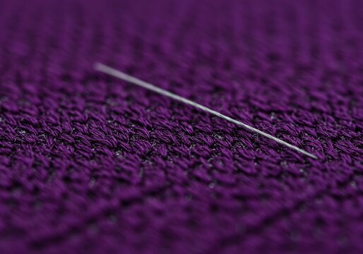 Close-up of intricate purple embroidery stitches on fabric, showcasing traditional textile art and delicate needlework design and texture ,texture ,purple ,skill