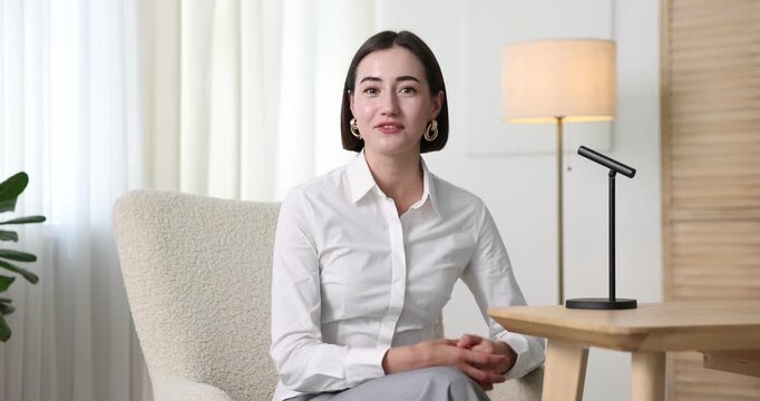 Podcast host recording talk show indoors, view from camera