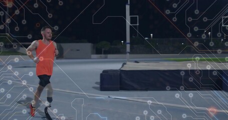 Sprinting athlete wearing orange top and shorts on blue track, showing prosthetic blade, copy space