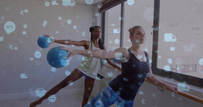Fototapeta Balancing partners stretching at barre by fitness studio windows, with balls and floating icons