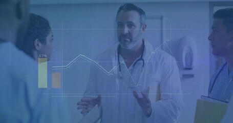 Discussing patient data doctors reviewing chart overlay in hospital corridor with stethoscopes