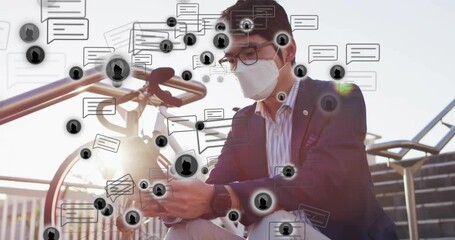 Masked commuter powering tablet at bicycle rack, viewing floating digital alerts to check messages - Powered by Adobe