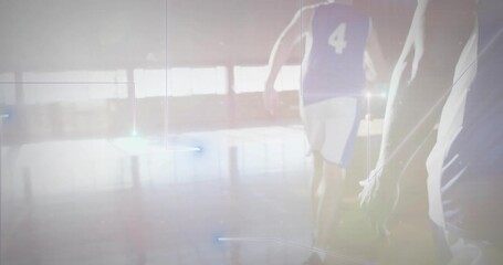 Number 4 player adjusting grip walking court, dribbling basketball past teammate practicing drill - Powered by Adobe