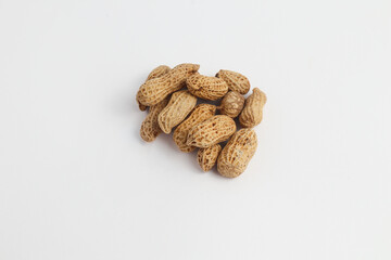 Raw peanuts in shells isolated on white background