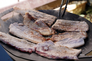 Sizzling Korean BBQ Pork Belly (Samgyeopsal) on a Hot Griddle