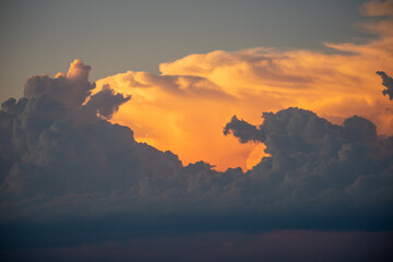 Dramatic sunset sky over Santa Cruz, Bolivia. Voluminous clouds illuminated by vibrant orange and deep gray tones, capturing the rich texture and atmospheric depth of a tropical evening. Part of a six