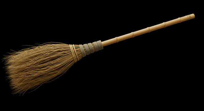 Handmade Javanese broom crafted from coconut leaf sticks, known as &ldquo;sapu lidi,&rdquo; isolated on white background for traditional and cultural design themes.