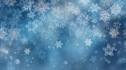 Delicate ice crystals drift against a soft blue, blurred background, evoking a winter wonderland
