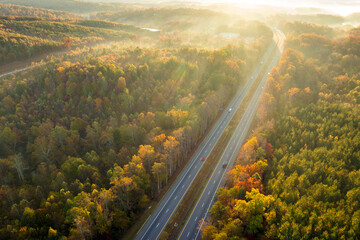 Highway road in USA. American freeway road with fast driving cars. Transportation infrastructure in North Carolina Appalachian mountains