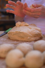 Kneading dough in a rustic kitchen setting